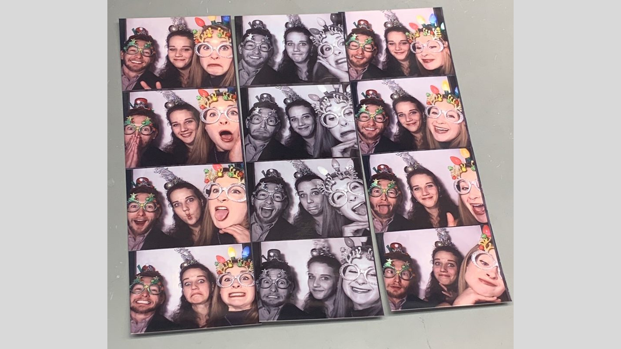 2019-12 Jake, Hillary, and Monica take advantage of the photo booth at the VICC Holiday Party.