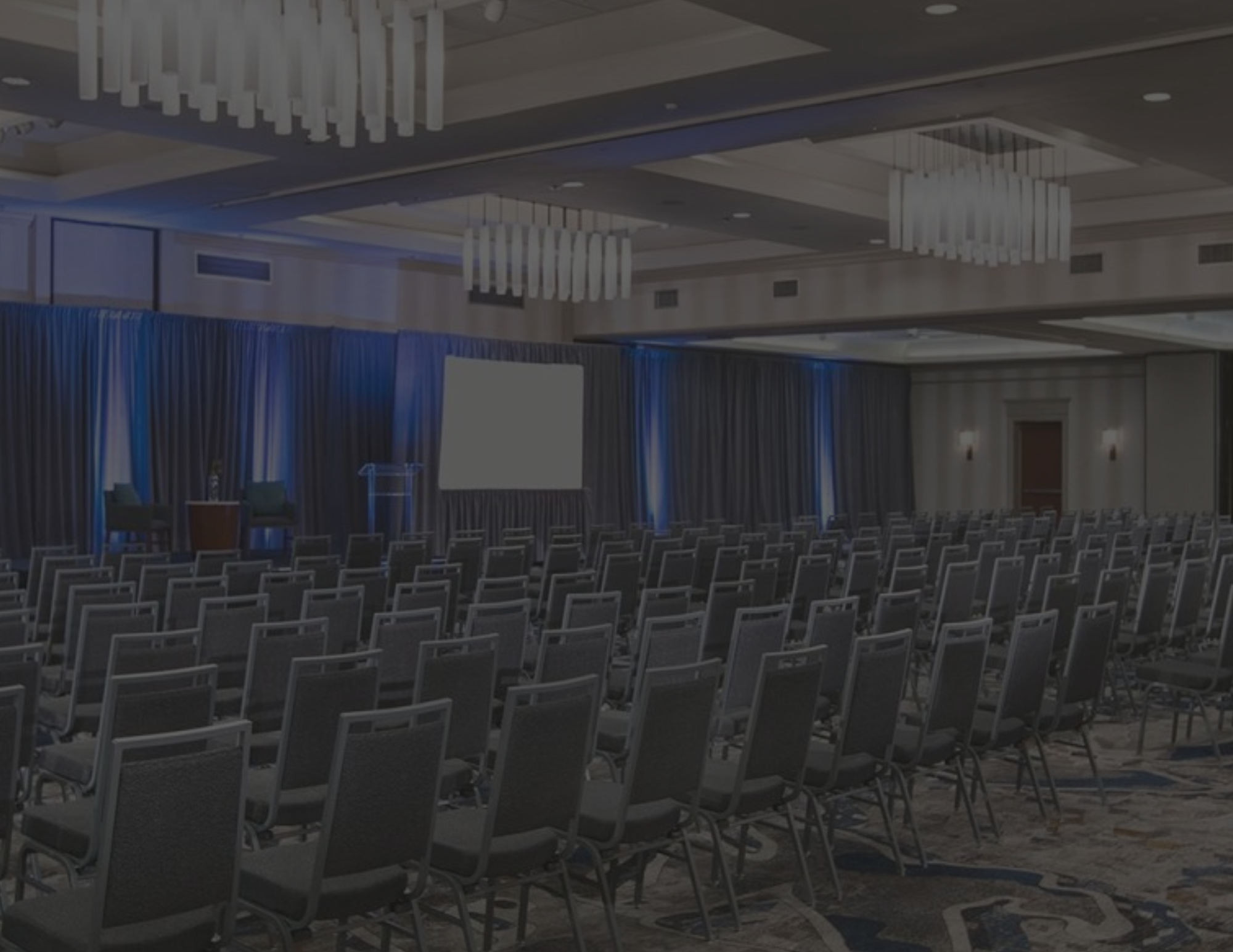 Chairs line a nice ballroom