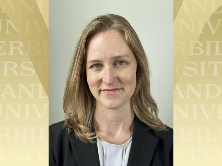 Headshot of Sonja Fulmer with Vanderbilt gold logo in the background