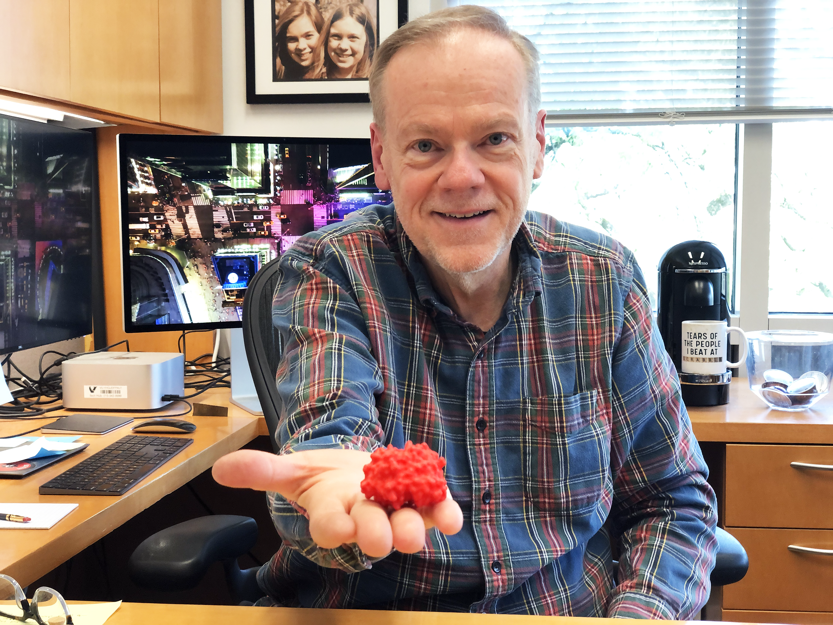 William Tansey holding 3-D model of WDR5 protein.