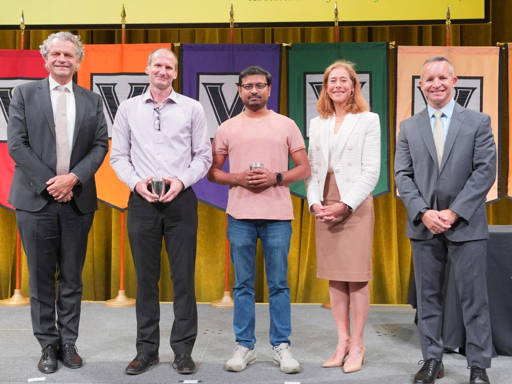 Photo of faculty award ceremony and award recipients.