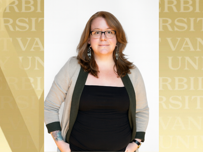 Hannah Collins headshot with gold VU background