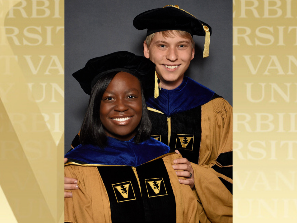 Photo of Kristin Kwakwa (front) and Kalen Petersen in their Vanderbilt doctoral graduation regalia. The image is overlaid over a golden background emblazoned with the Vanderbilt name.