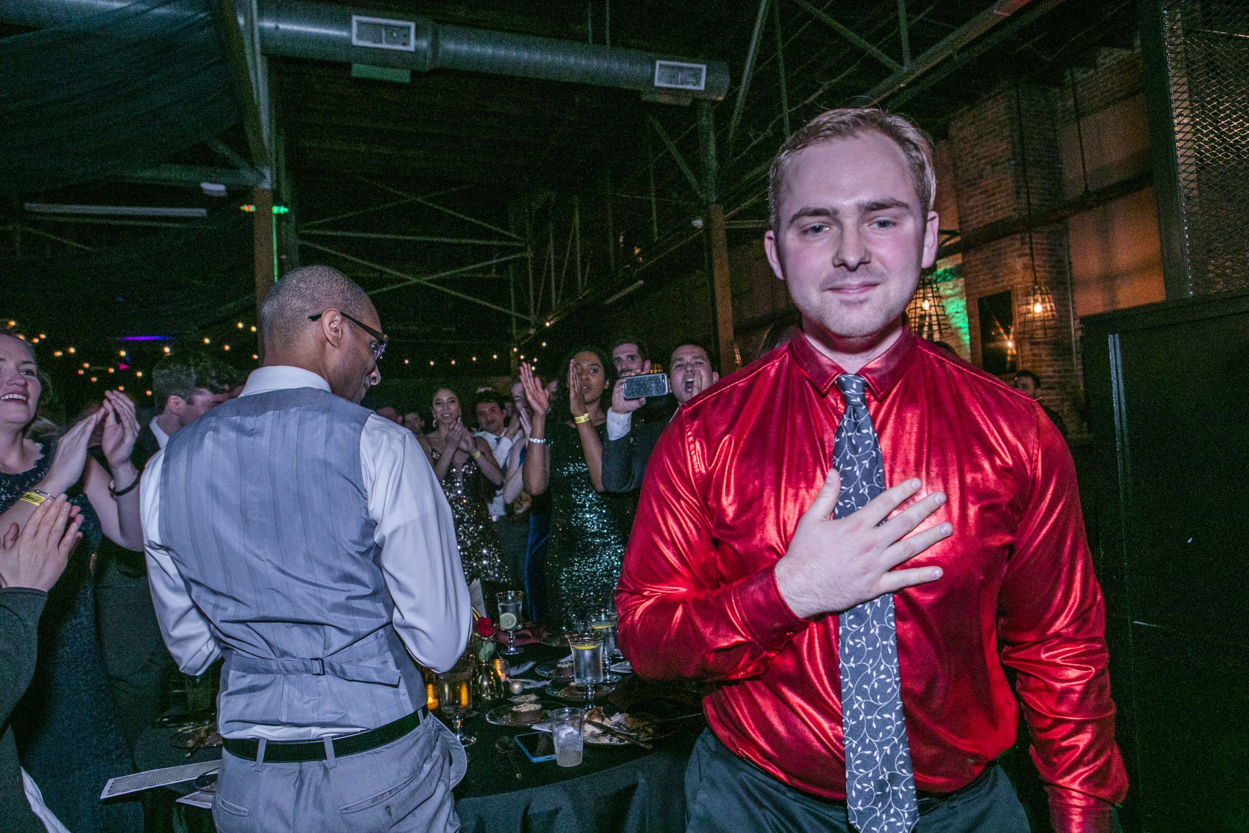 A man has his hand over his heart