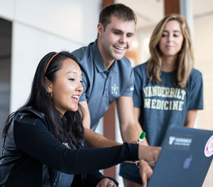 students looking at a laptop