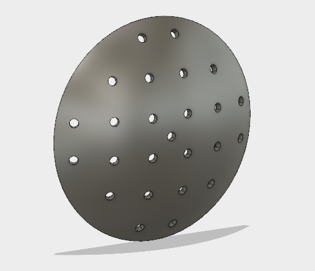 This version of the perimeter dome lacks walls and would be mounted inside the empty chamber of a VR headset so that it can be seen by a patient wearing the headset. The dome itself is around 7.5 cm in diameter.