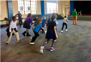 Jon Hodgson (South Africa, 18-19) teaching students “Robot” – a South African version of Red light/Green light