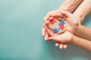 adult-chiild-hands-holding-jigsaw-puzzle-heart-shape-autism-awareness-autism-spectrum-family-support-concept-world-autism-awareness-day_49149-1213