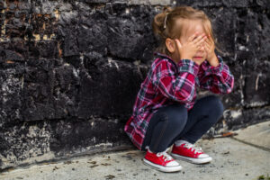 little-beautiful-girl-near-brick-wall_169016-3553