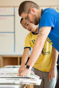 A teacher at Capital City Public Charter School provides feedback on a student’s science poster. Photo by Allison Shelley/The Verbatim Agency for American Education: Images of Teachers and Students in Action