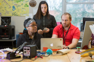 A teacher reviews students’ project notes on a computer. Photo by Allison Shelley/The Verbatim Agency for American Education: Images of Teachers and Students in Action