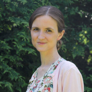 person with flora dress smiling