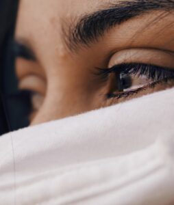 a close up of image of woman with tears in her eyes