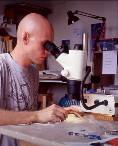 Dr. Eberl manually identifying microdebitage in a soil sample