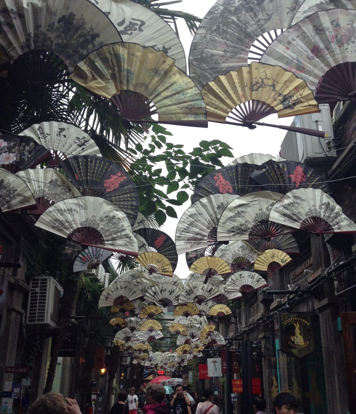 Decorative Fans Hang Above, courtesy of Deji Adeniyi