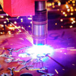 CNC Laser plasma cutting of metal, modern industrial technology.