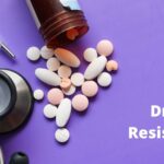 Medical pills on a purple background with the words "Drug Resistance"