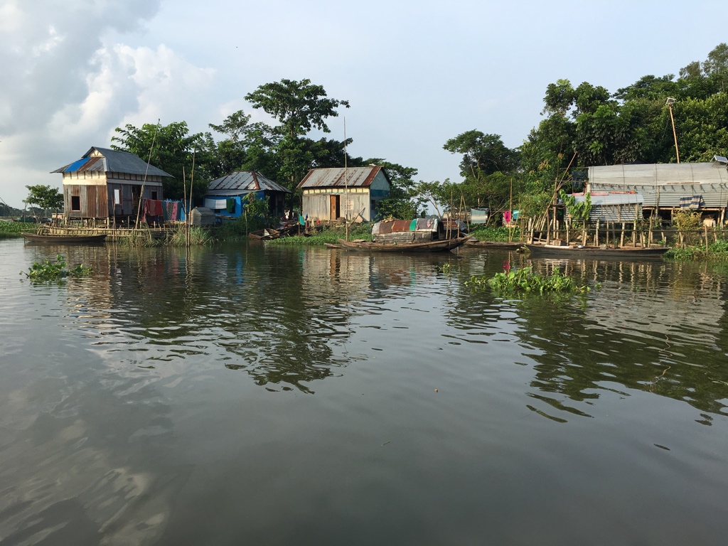 Buildings and boats with water encroaching