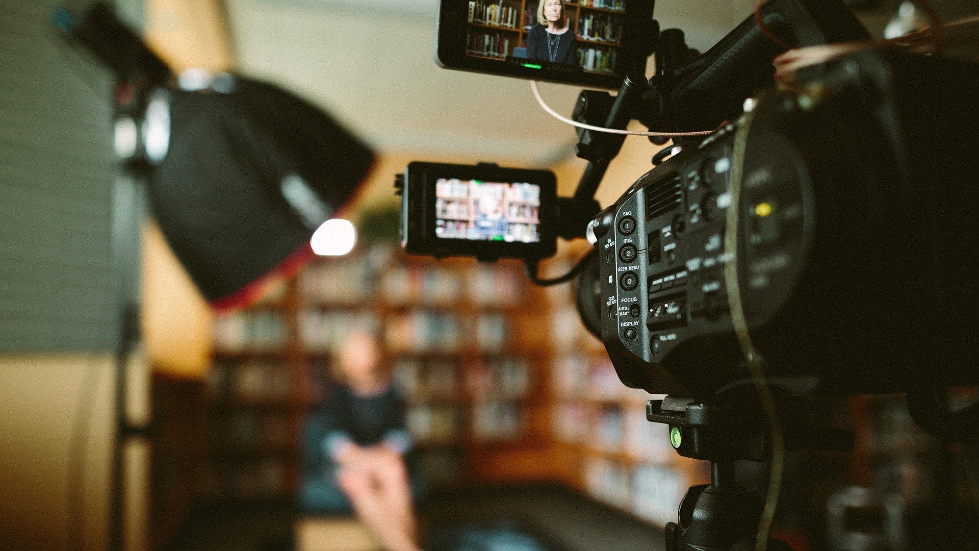 Image of woman being interviewd with a video camrea