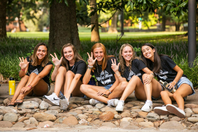 group of students sitting outside