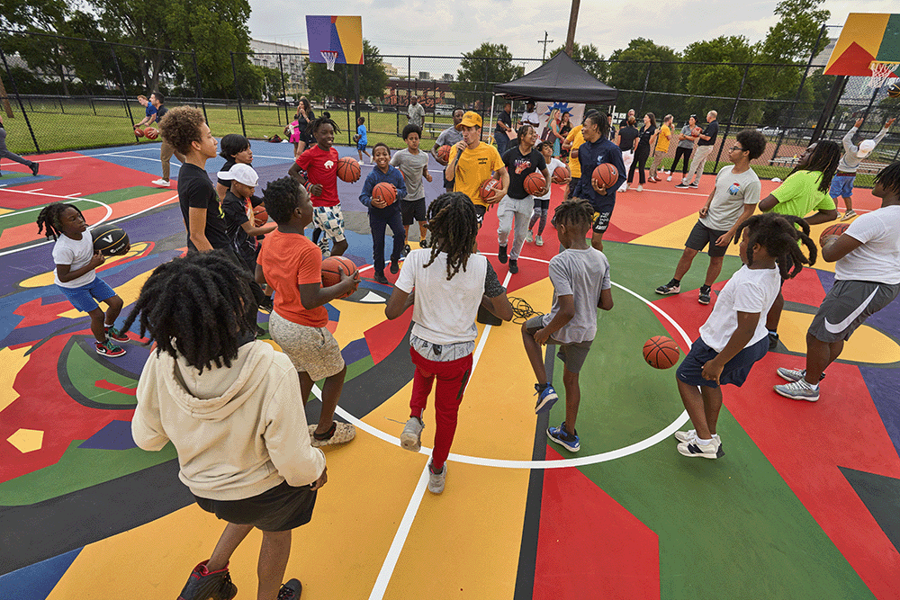children from the North Nashville community playing basketball at Watkins Park