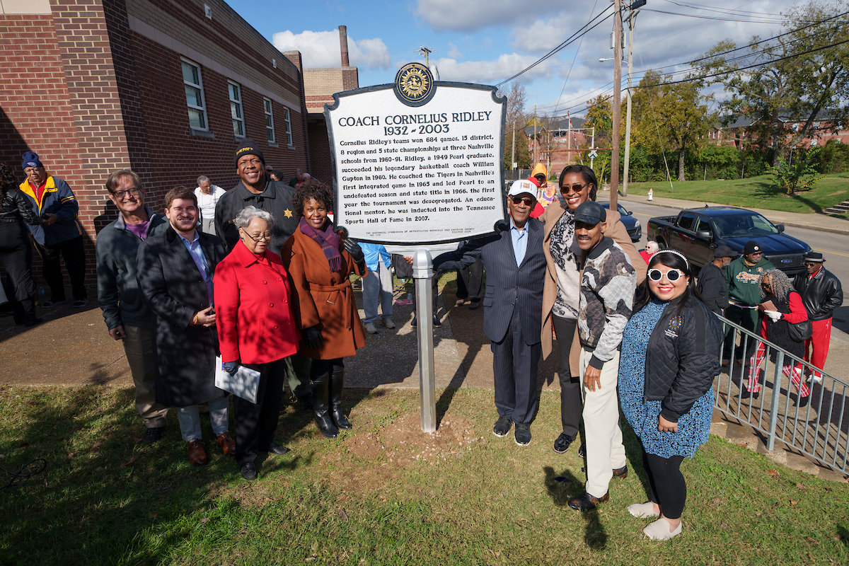 Community members gathered around the new historical marker honoring Coach Cornelius Ridley on Nov. 22, 2024. (Harrison McClary/Vanderbilt University)