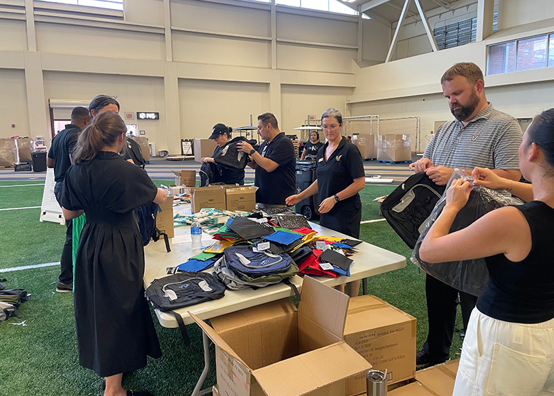 Vanderbilt student-athletes and staff volunteer with PENCIL on a backpack-stuffing project