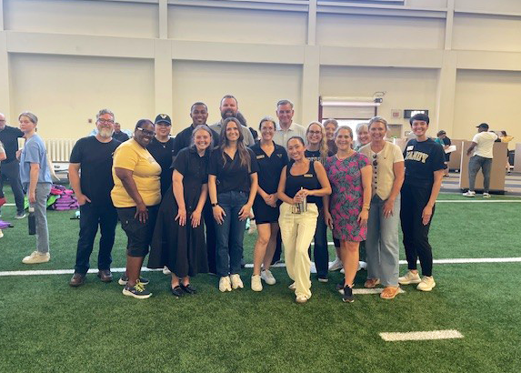 Vanderbilt student-athletes and staff volunteer with PENCIL on a backpack-stuffing project. 