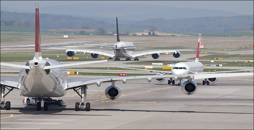 Three passenger aircrafts in heavy traffic on the taxiway. (Getty Images)