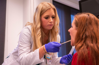 A sexual assault nurse examiner conducts a forensic examination during simulation. (Vanderbilt University)