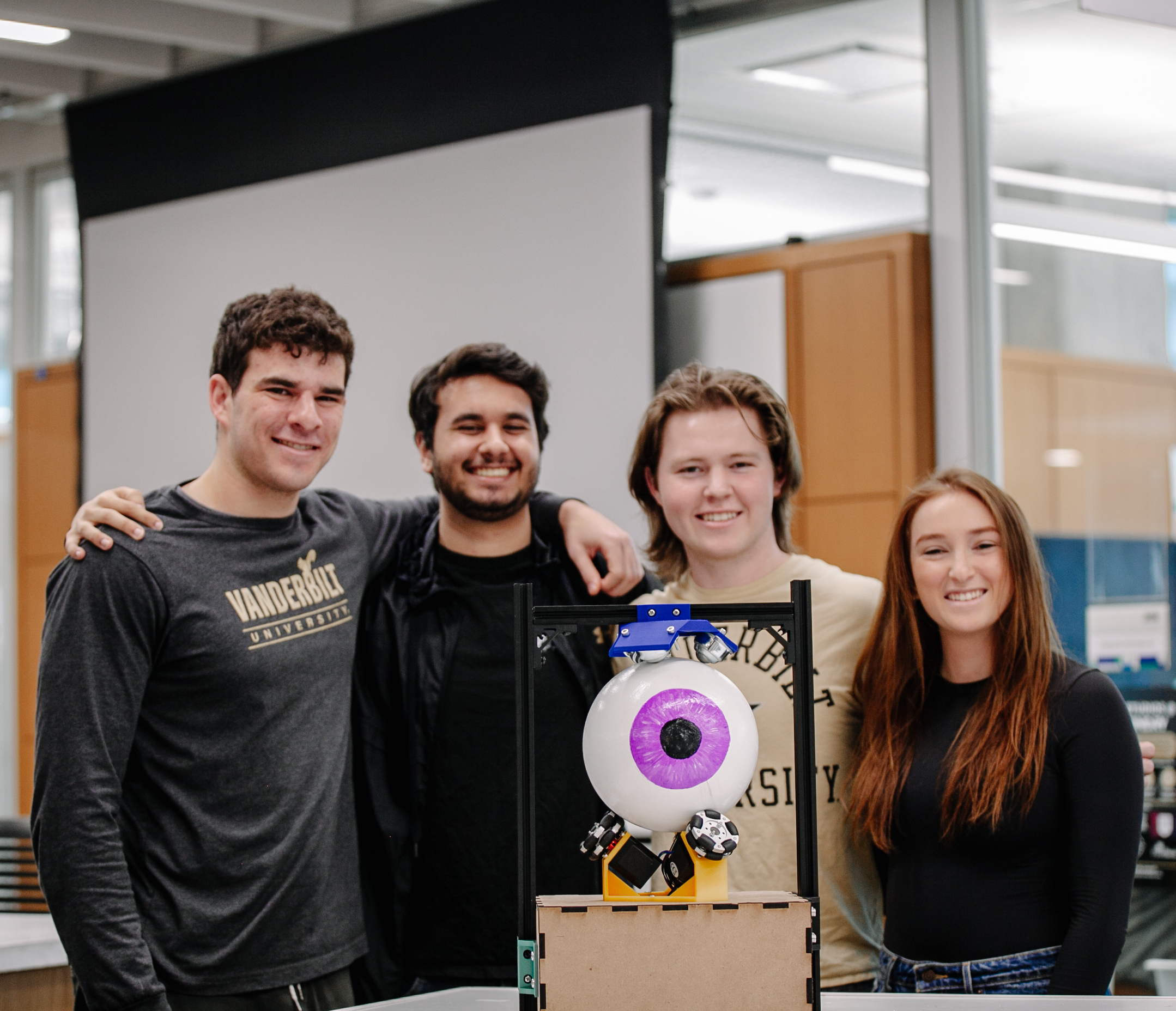 VU students stand with their animatronic eye, left to right: Ari Horwitz, Henry Dirksen, Jackson Singer, Kaylee Greenburg.