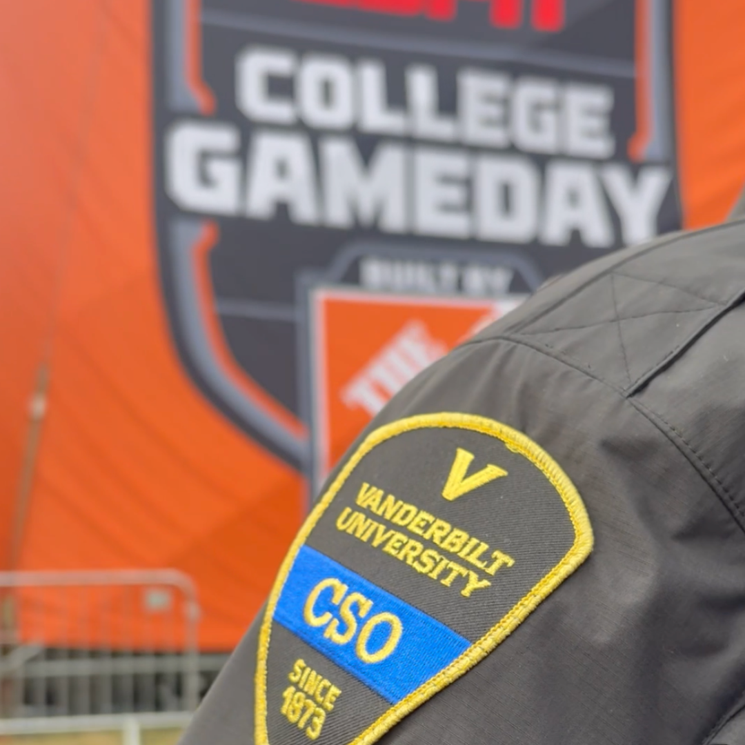 Pictured: Arm of a VUPS CSO showing the patch in front of the College GameDay logo.