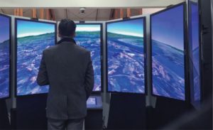 First-year MBA Winston Ling views Earth from an outer space point of view while visiting Google headquarters in Mountain View, California. “Googlers” can spend 20 percent of their time working on side projects related to the business. One of Google’s engineers created the viewing booth—an interactive toy essentially—so people could use it to go around the Earth from space. Google’s Heather Webb, MBA’07, hosted the Vanderbilt visit. Photo Credit: Samantha Levine