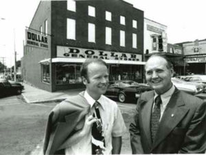 Cal Turner Jr., left, and Cal Turner Sr. chat outside a store in Scottsville, Kentucky, where their company began. Today, Dollar General is headquartered just outside Nashville, with stores in 44 states.