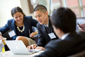 Accelerator students work together to solve business challenges