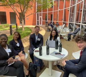 Vanderbilt Accelerator students gather around a table in the Owen Graduate School of Management courtyard.