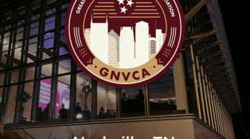 Pictured: The outside of Management Hall at Vanderbilt Business on the night of the Greater Nashville Venture Capital Association kickoff event. The GNVCA logo is displayed over the picture of the building.