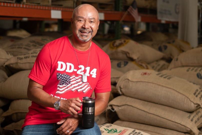 Pictured: Executive MBA alum Al Lopez in his coffee warehouse