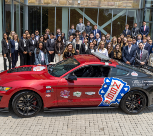 Pictured: Nashville Super Speedway brought a racecar to Vanderbilt Business for Accelerator students to see. This is a group photo of the 2023 Accelerator students gathered behind a racecar outside of Management Hall.
