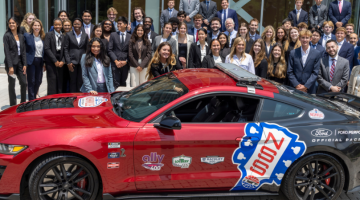 Pictured: Nashville Super Speedway brought a racecar to Vanderbilt Business for Accelerator students to see. This is a group photo of the 2023 Accelerator students gathered behind a racecar outside of Management Hall.