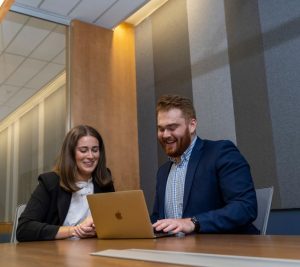 Pictured: Two Vanderbilt MAcc students looking at computer