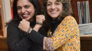 Pictured: Photo from The Tennessean - Celebrity chef Maneet Chauhan, left, executive chef at participating restaurant Chauhan Ale & Masala House, models an "Embrace the Nations in Our Neighborhood" wristband with organization founder Renuka Christoph. Complete Capture LLC.