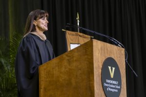 Pictured: Maria Renz, Vanderbilt Business 2024 Commencement Speaker, standing at the podium delivering her keynote address. 
