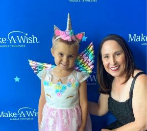 Pictured: Beth Torres poses with Make-A-Wish recipient