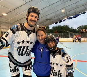 Pictured: Beth Torres poses with Make-A-Wish recipient and Predators player