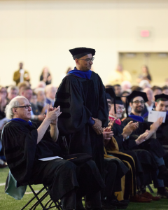 Pictured: Vanderbilt Business Faculty members are cheering for their colleagues at commnecement.