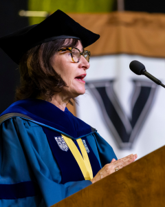 Pictured: Jennifer Edson Escalas of Vanderbilt Business stands at a podium.
