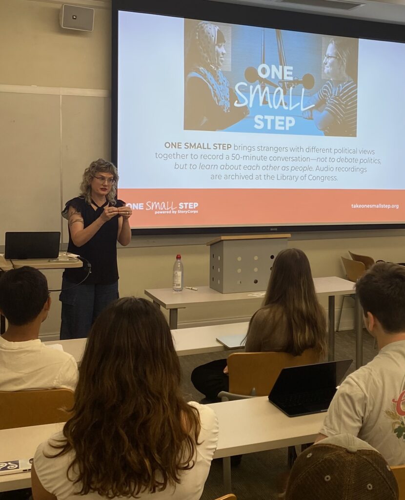 Stephanie Glaros presenting at the front of the classroom at he One Small Step Workshop