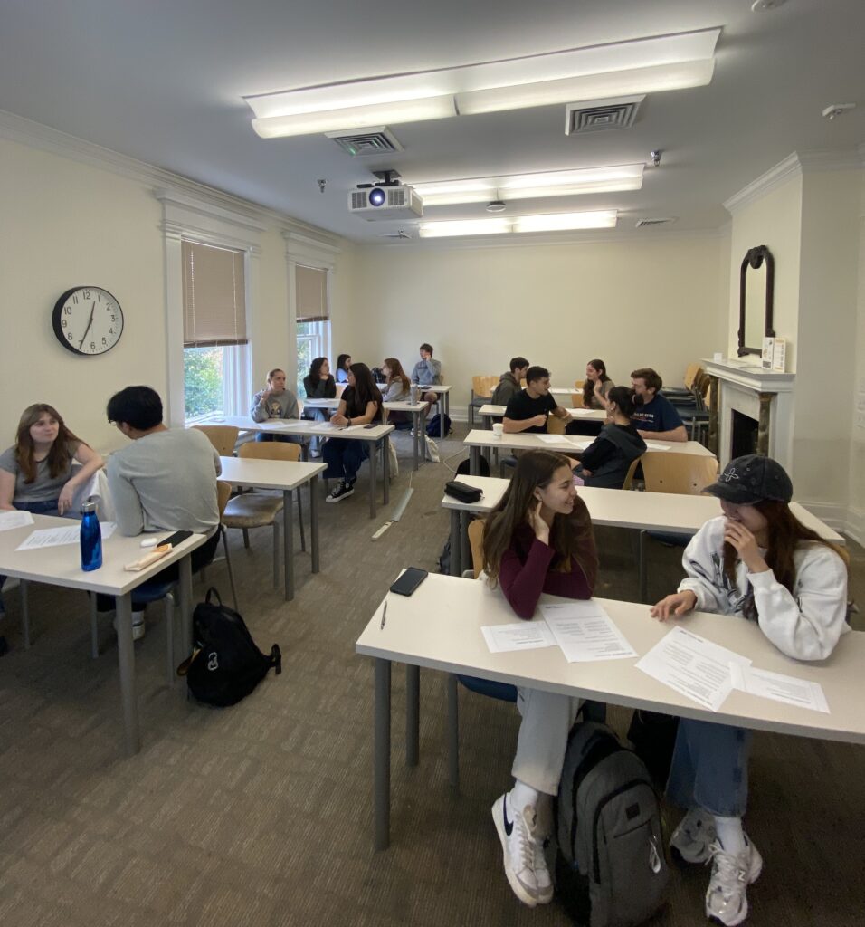 students working together at desks at the One Small Step Workshop