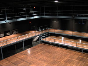 Empty auditorium with wood floor.